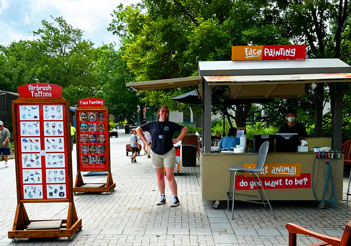 Hartmann's face painting and airbrush tattoo booth at the Toledo Zoo