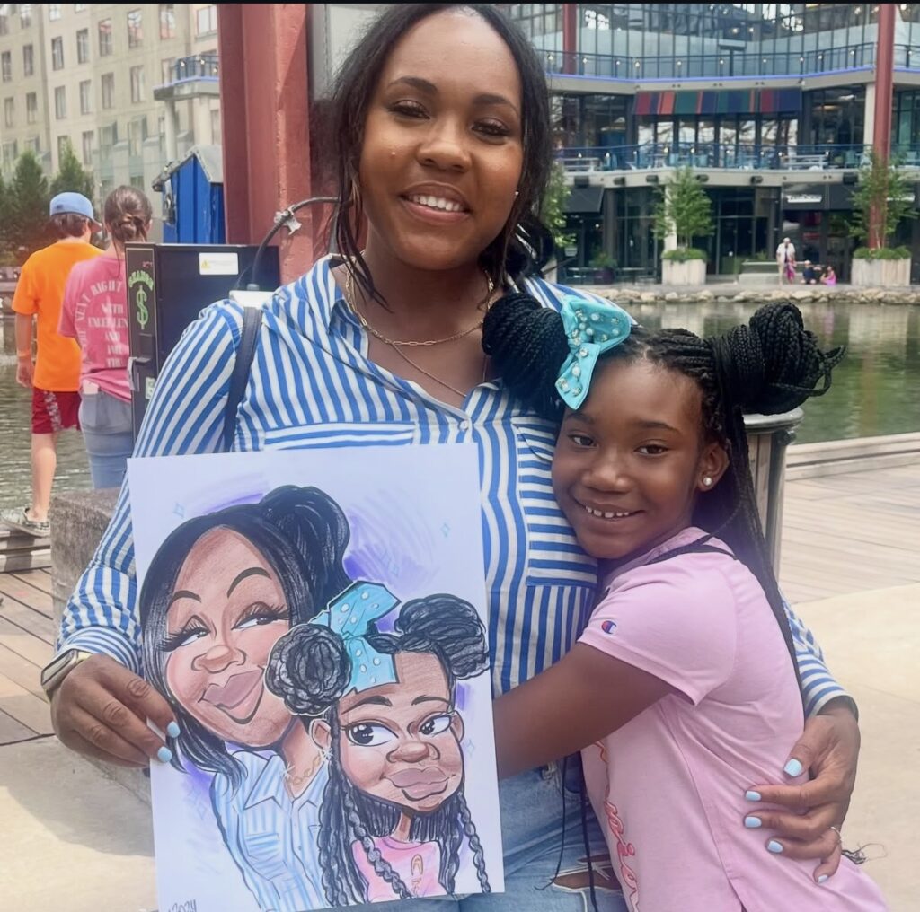 Mother and daughter holding their color caricature