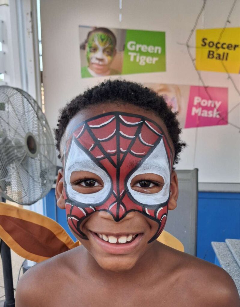 Boy with a Spider-Man face painting