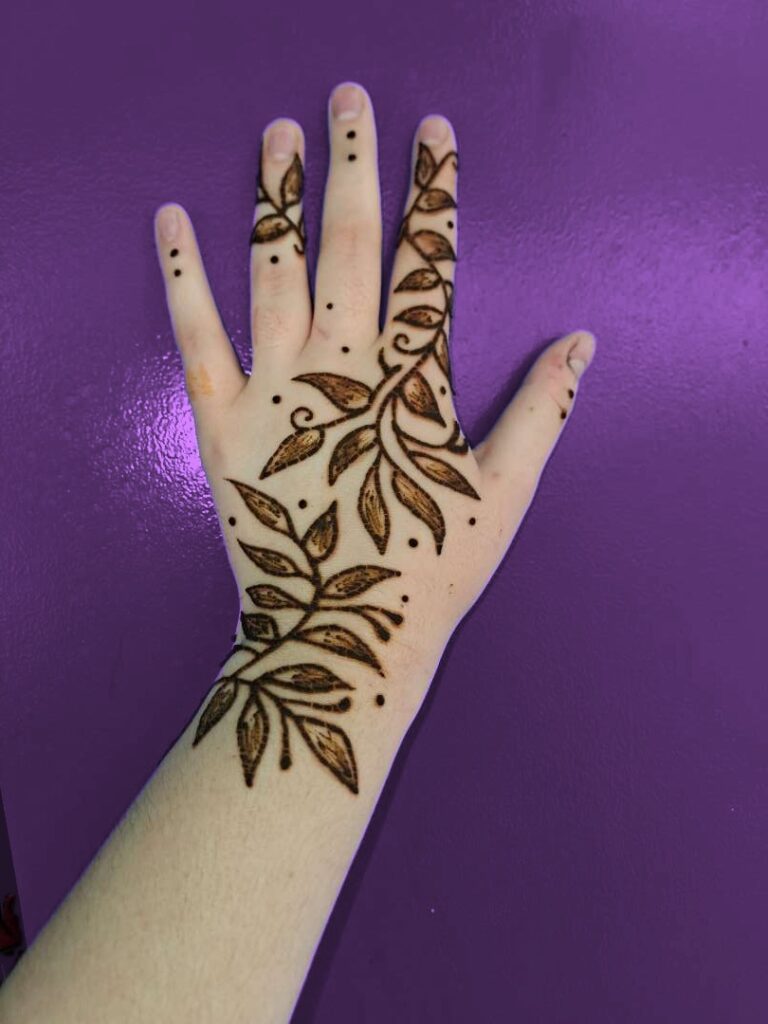 Leafy vine henna tattoo on a hand